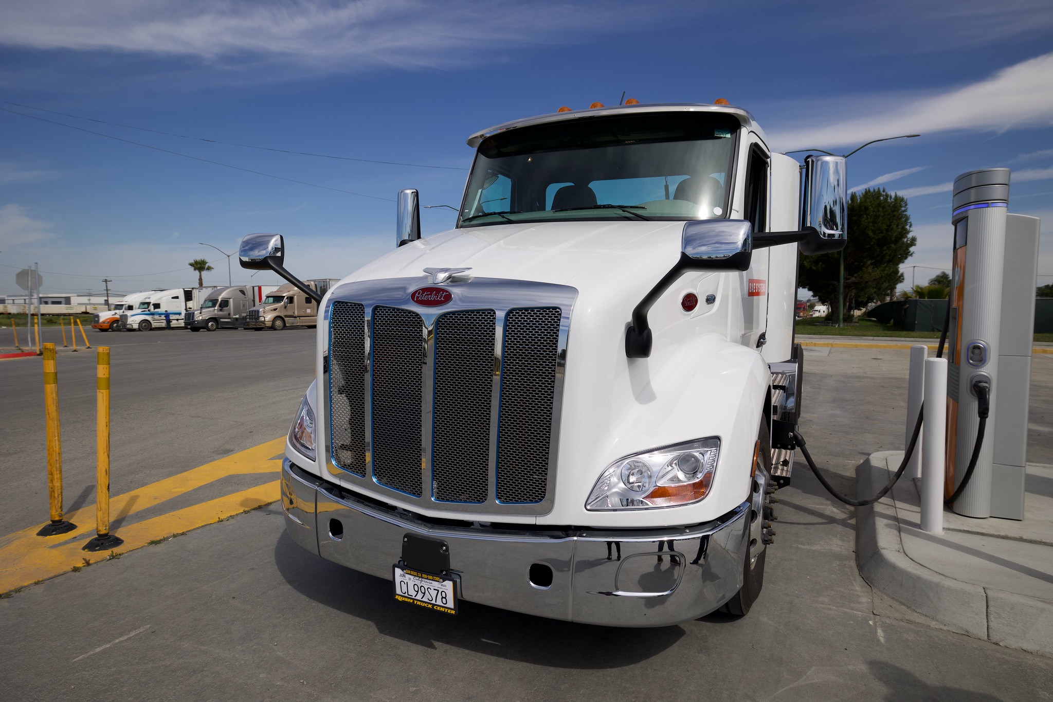 Photo of truck at a charging station. 