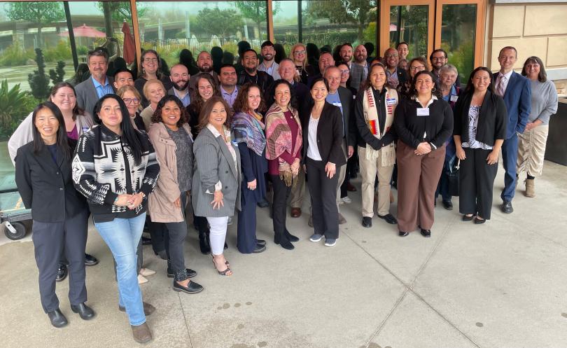 Pala Band of Mission Indians, the Tribal Energy Climate Collaborative, and the California Public Utilities Commisson, the California Energy Commission individuals Standing in a group in front of the event bulding.