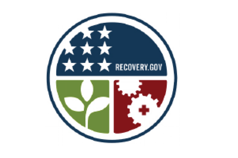 Pictograph signifying the American Recovery Act as a circle, top half stars and text, lower left quarter a plant and lower right cog and gears
